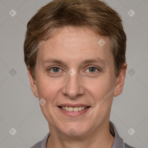 Joyful white adult female with short  brown hair and grey eyes