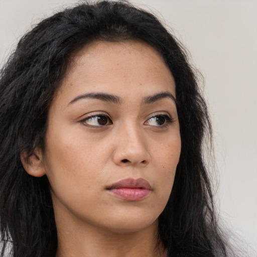 Neutral latino young-adult female with long  brown hair and brown eyes