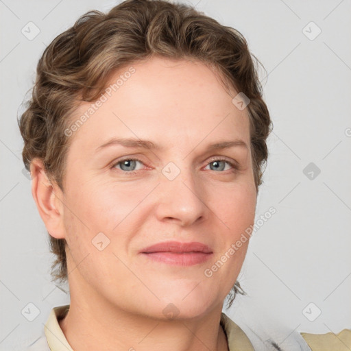 Joyful white young-adult female with short  brown hair and blue eyes