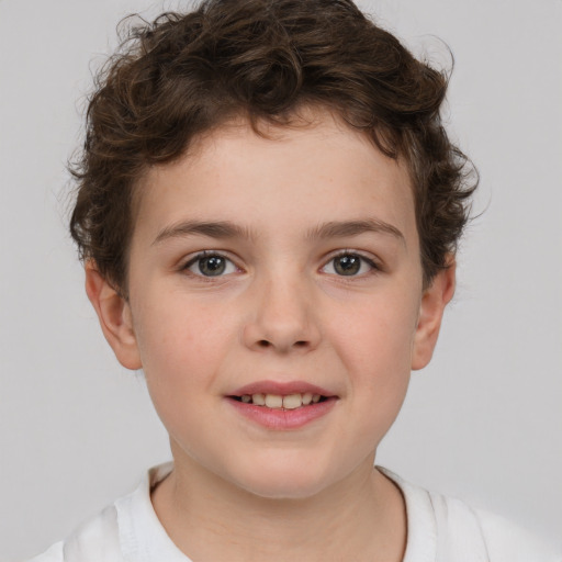 Joyful white child female with short  brown hair and brown eyes