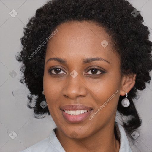 Joyful black young-adult female with medium  black hair and brown eyes