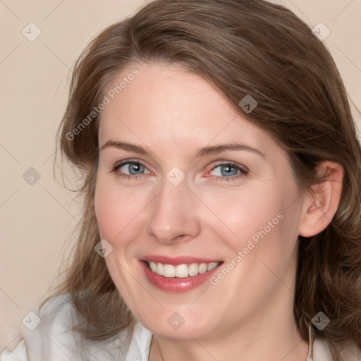 Joyful white young-adult female with medium  brown hair and blue eyes