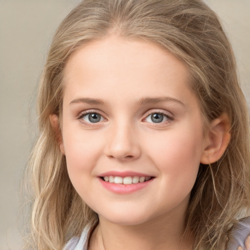 Joyful white child female with medium  brown hair and grey eyes