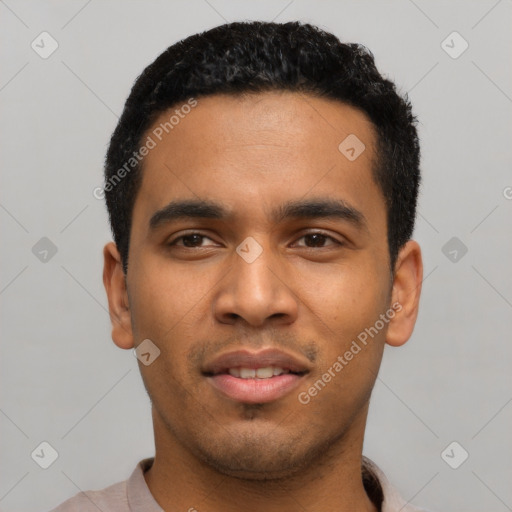 Joyful latino young-adult male with short  black hair and brown eyes