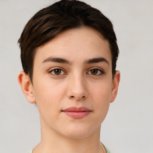 Joyful white young-adult female with short  brown hair and brown eyes