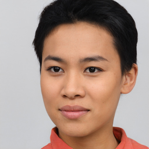 Joyful asian young-adult female with short  black hair and brown eyes