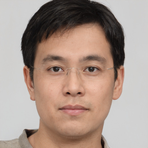 Neutral asian young-adult male with short  brown hair and brown eyes