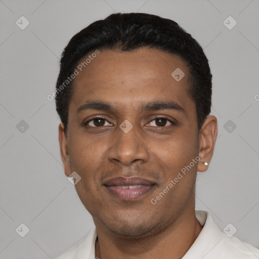 Joyful black young-adult male with short  black hair and brown eyes