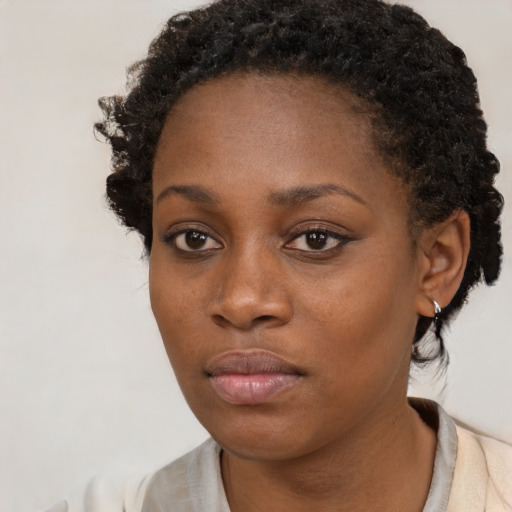 Neutral black young-adult female with short  brown hair and brown eyes
