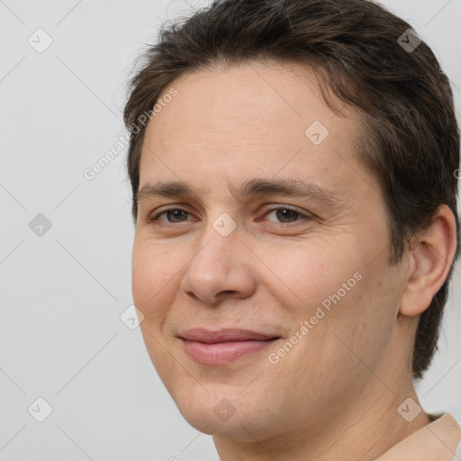 Joyful white adult female with short  brown hair and brown eyes