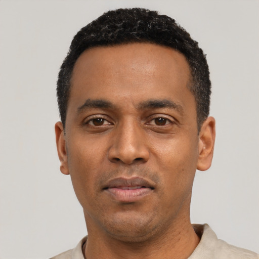 Neutral black young-adult male with short  black hair and brown eyes