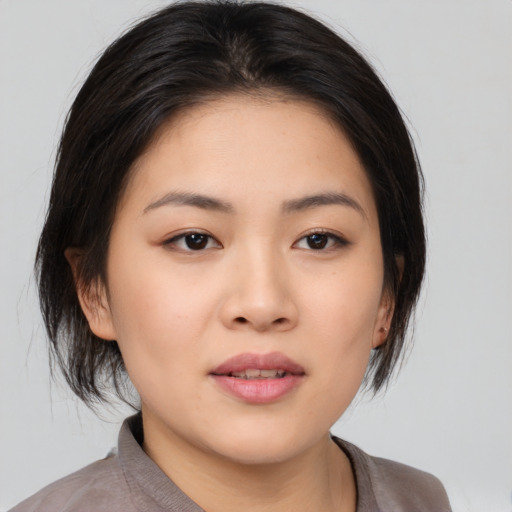 Neutral asian young-adult female with medium  black hair and brown eyes
