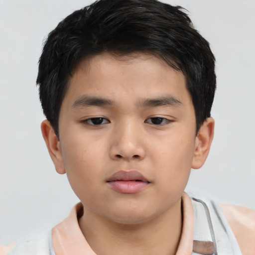 Neutral asian child male with short  brown hair and brown eyes