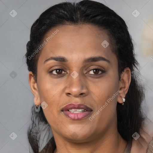 Joyful latino adult female with medium  brown hair and brown eyes