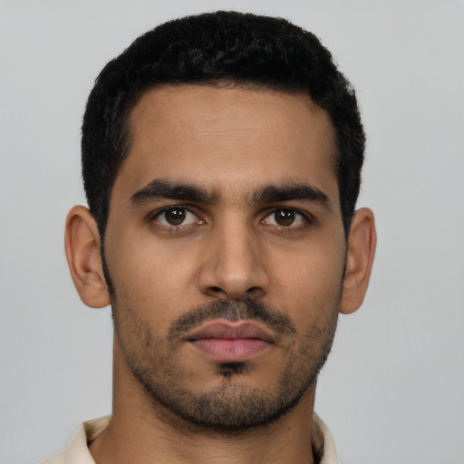 Neutral latino young-adult male with short  black hair and brown eyes