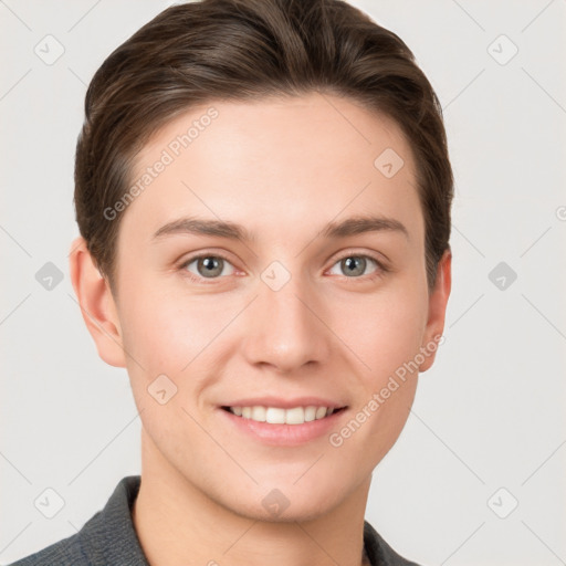 Joyful white young-adult female with short  brown hair and grey eyes