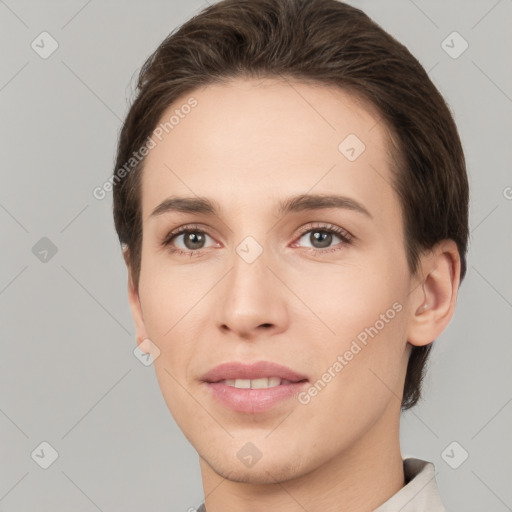 Joyful white young-adult female with short  brown hair and brown eyes