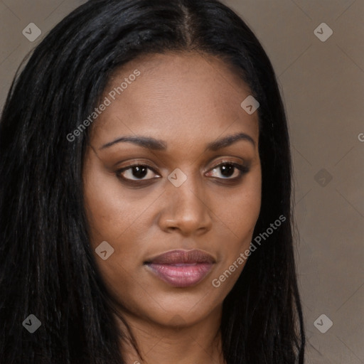 Joyful black young-adult female with long  brown hair and brown eyes