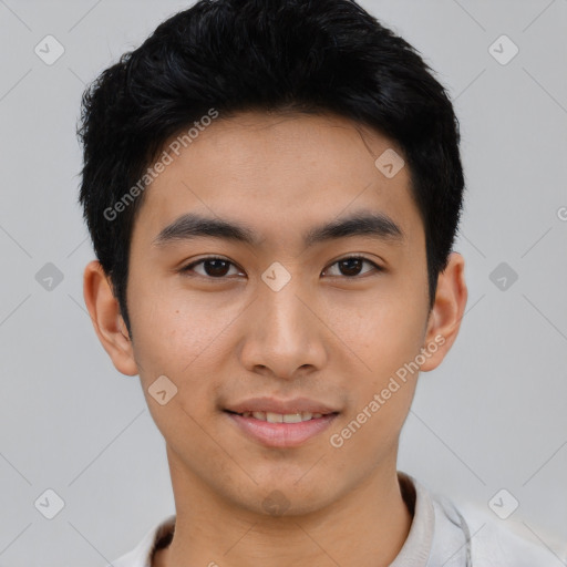 Joyful asian young-adult male with short  black hair and brown eyes