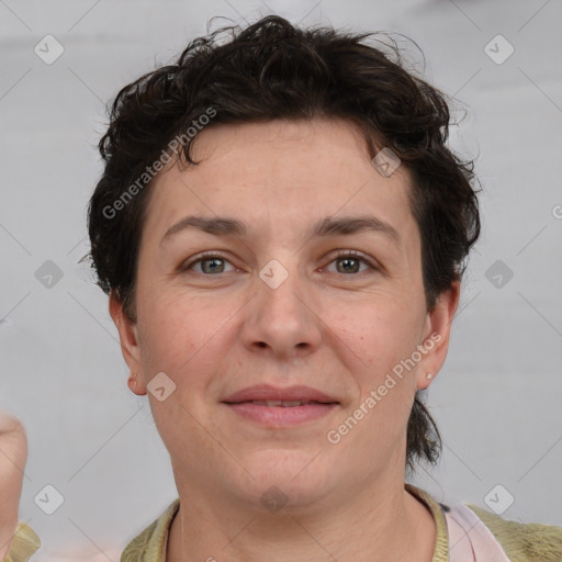 Joyful white adult female with short  brown hair and brown eyes