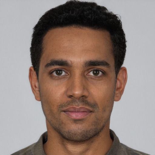 Neutral black young-adult male with short  black hair and brown eyes