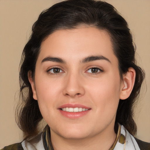 Joyful white young-adult female with medium  brown hair and brown eyes