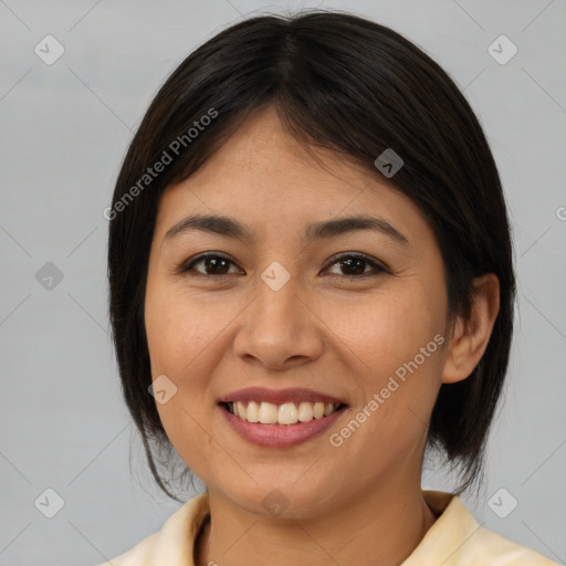 Joyful latino young-adult female with medium  brown hair and brown eyes