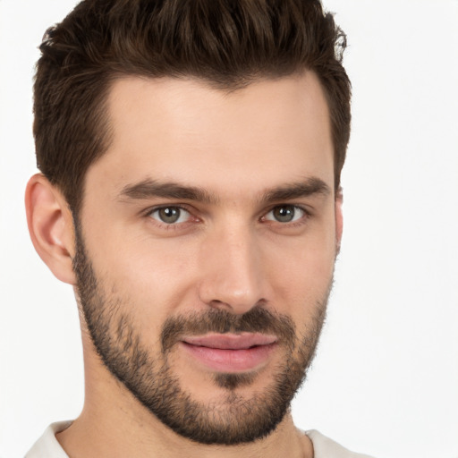 Joyful white young-adult male with short  brown hair and brown eyes