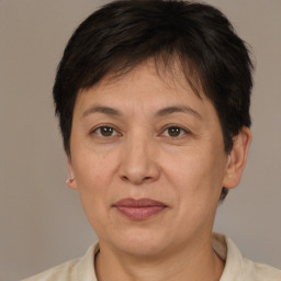 Joyful white adult female with short  brown hair and brown eyes