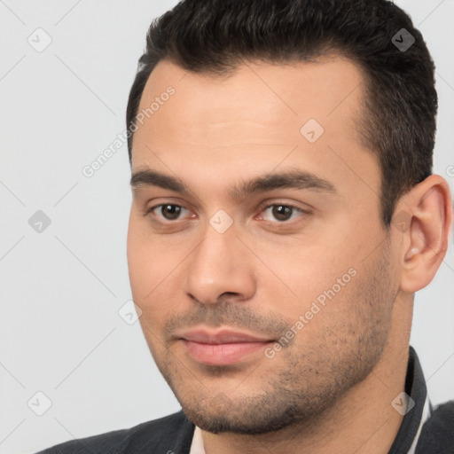 Joyful white young-adult male with short  brown hair and brown eyes