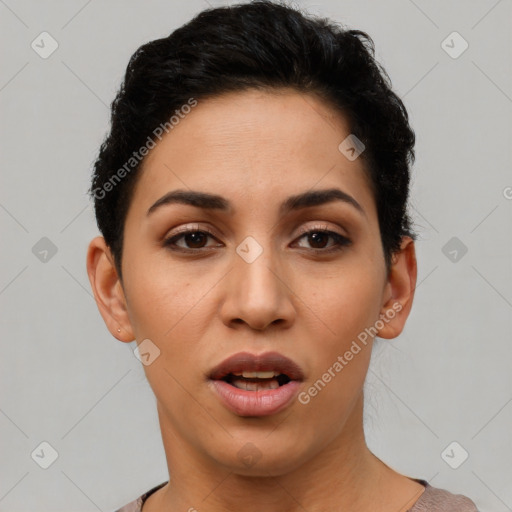 Joyful latino young-adult female with short  black hair and brown eyes