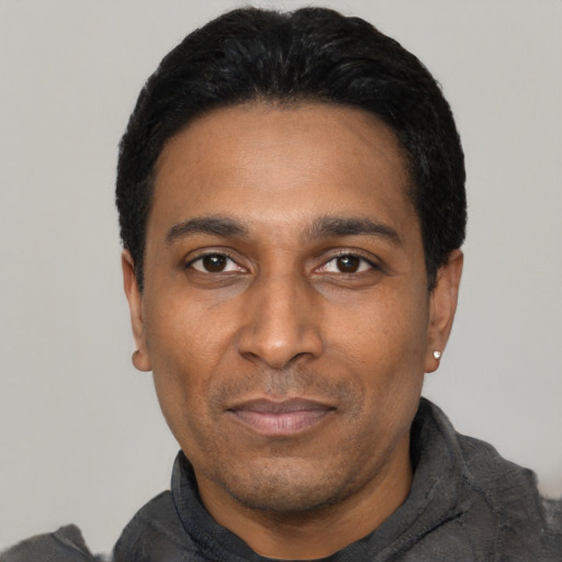 Neutral latino adult male with short  black hair and brown eyes