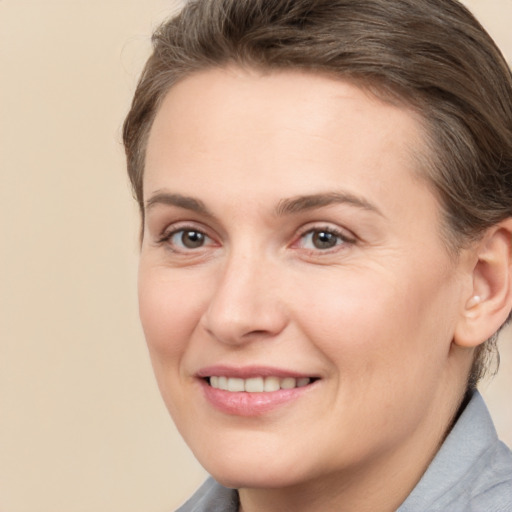 Joyful white adult female with short  brown hair and brown eyes