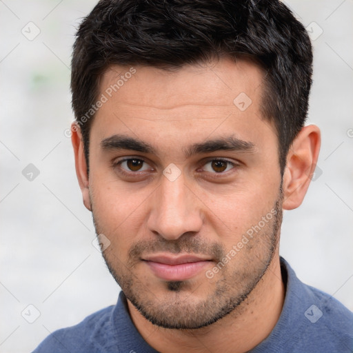 Joyful white young-adult male with short  black hair and brown eyes