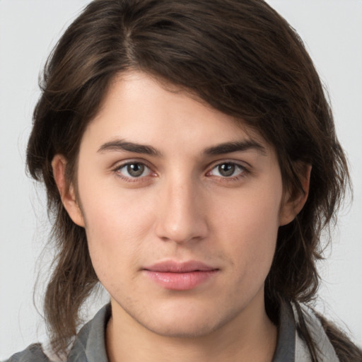 Neutral white young-adult female with medium  brown hair and brown eyes