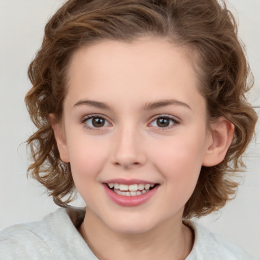 Joyful white child female with medium  brown hair and brown eyes