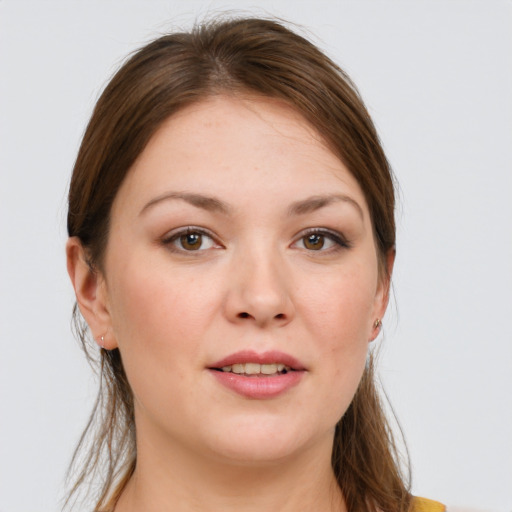Joyful white young-adult female with long  brown hair and grey eyes