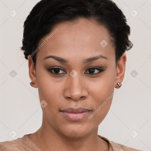 Joyful black young-adult female with short  black hair and brown eyes