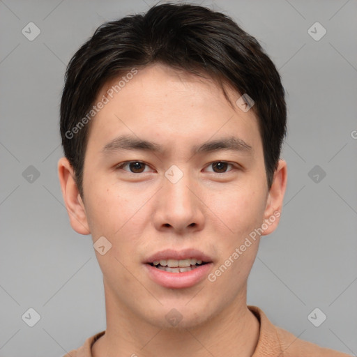 Joyful asian young-adult male with short  brown hair and brown eyes