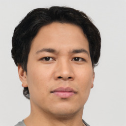 Neutral asian young-adult male with short  brown hair and brown eyes