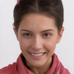 Joyful white child female with short  brown hair and brown eyes