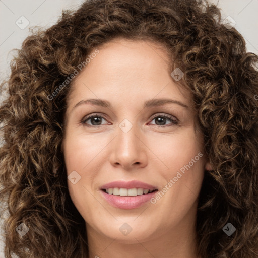 Joyful white young-adult female with long  brown hair and green eyes