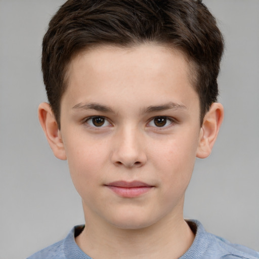 Joyful white child male with short  brown hair and brown eyes