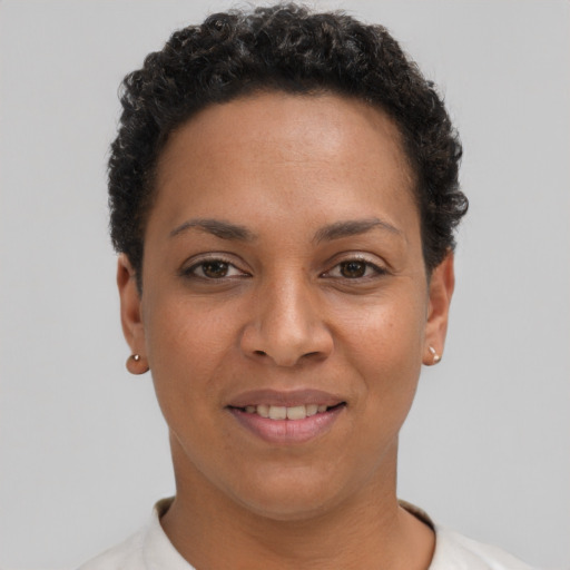 Joyful latino young-adult female with short  black hair and brown eyes