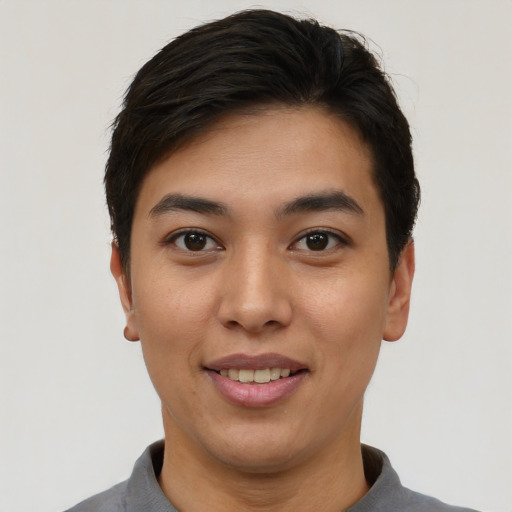 Joyful asian young-adult female with short  black hair and brown eyes