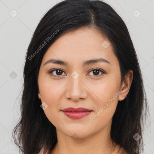 Joyful asian young-adult female with long  brown hair and brown eyes