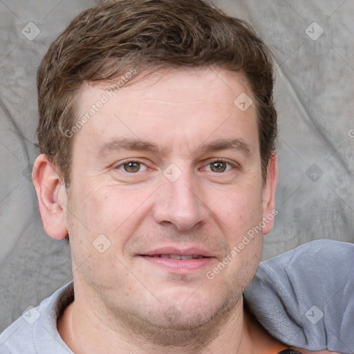 Joyful white adult male with short  brown hair and grey eyes