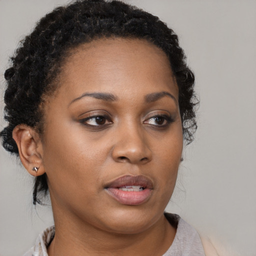 Neutral black young-adult female with short  brown hair and brown eyes
