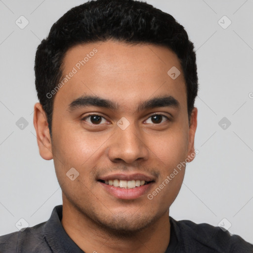 Joyful latino young-adult male with short  black hair and brown eyes