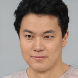 Neutral asian young-adult male with short  brown hair and brown eyes